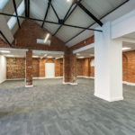 Open plan office space with supporting beams at 10 Empire Court offices to let Redditch