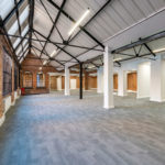 Bright internal photo of 10 Empire Court offices to let Redditch with exposed wooden beams and a pitched roof.