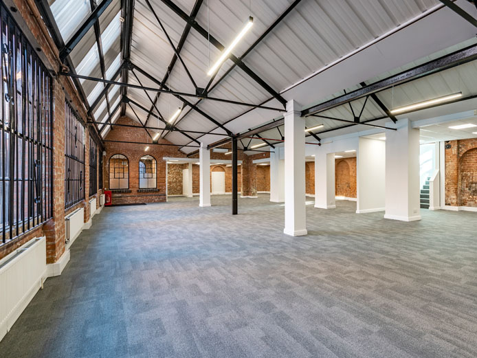 Bright internal photo of 10 Empire Court offices to let Redditch with exposed wooden beams and a pitched roof.