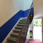 Internal view of stairs and front door leading onto car park - offices Birmingham