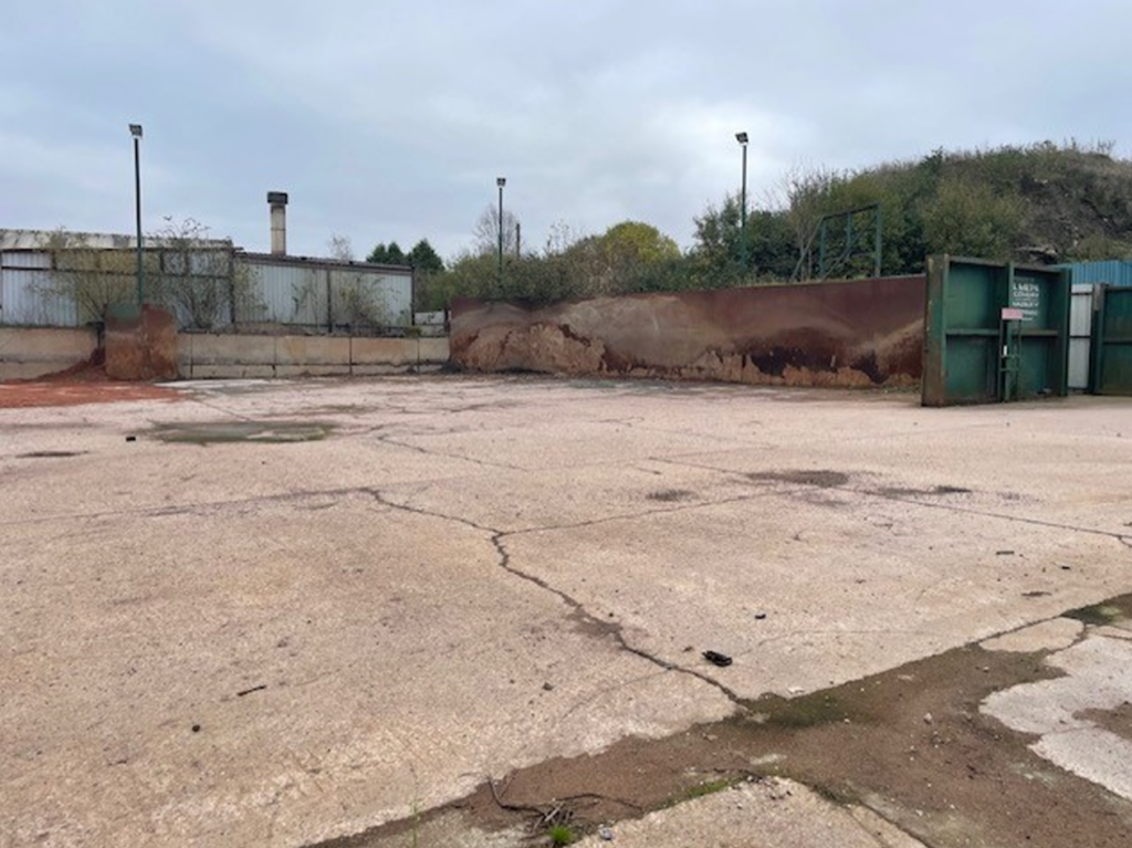 Surface of Oldfields industrial development land which varies from concrete to compound hardcore