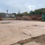 Surface of Oldfields industrial development land which varies from concrete to compound hardcore