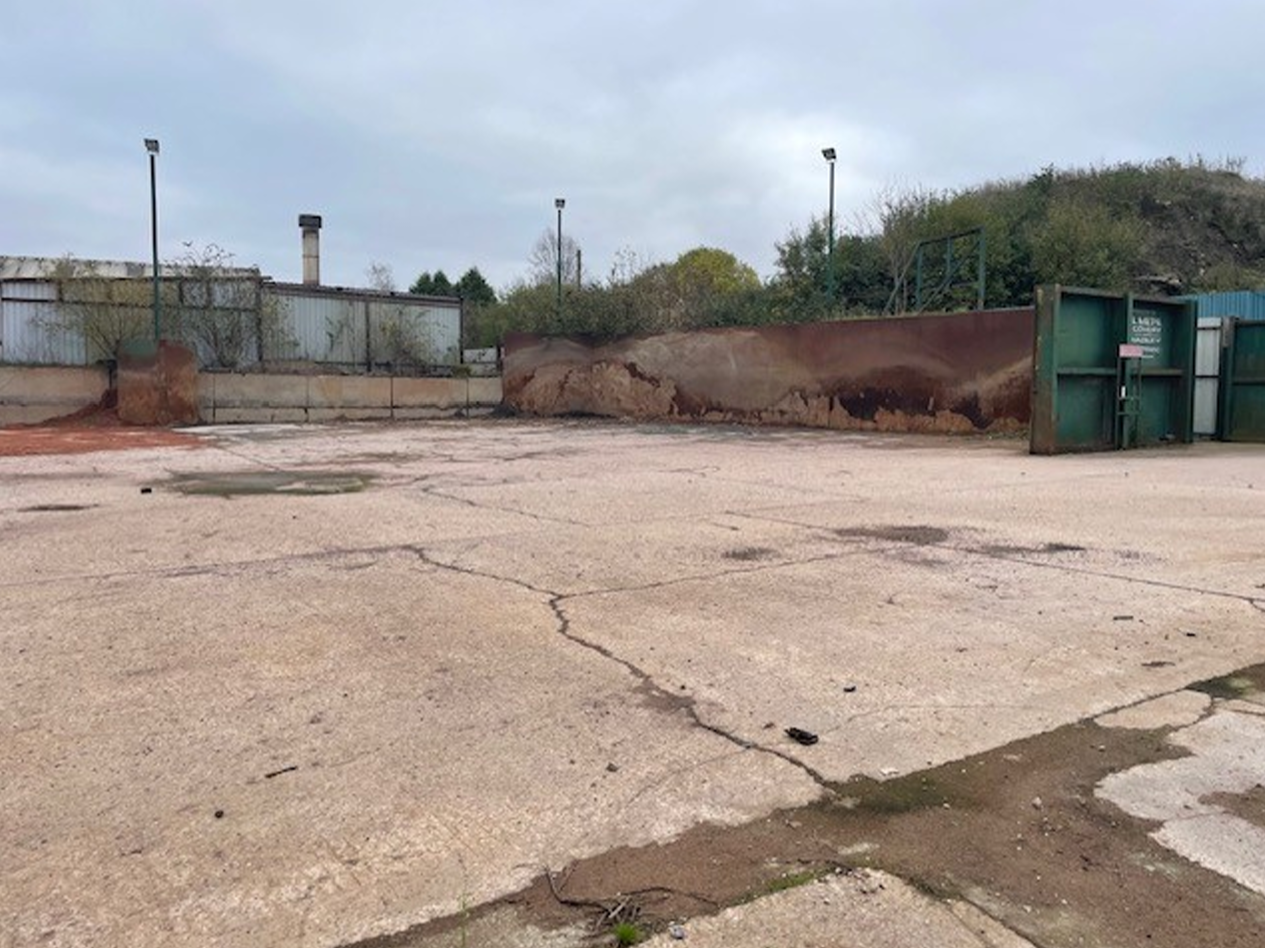 Surface of Oldfields industrial development land which varies from concrete to compound hardcore