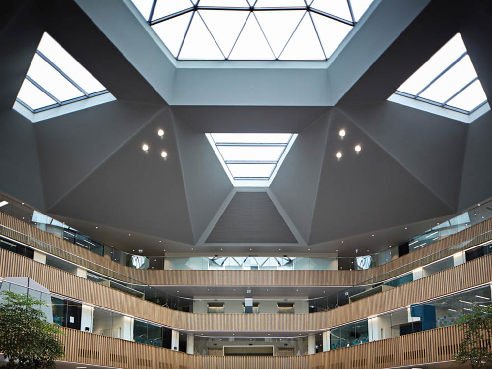 Impressive atrium within Ingenuity House, next to Birmingham Airport, which contributed two top-ten deals in the 2024 solihull office market with allianz taking the 5th spot