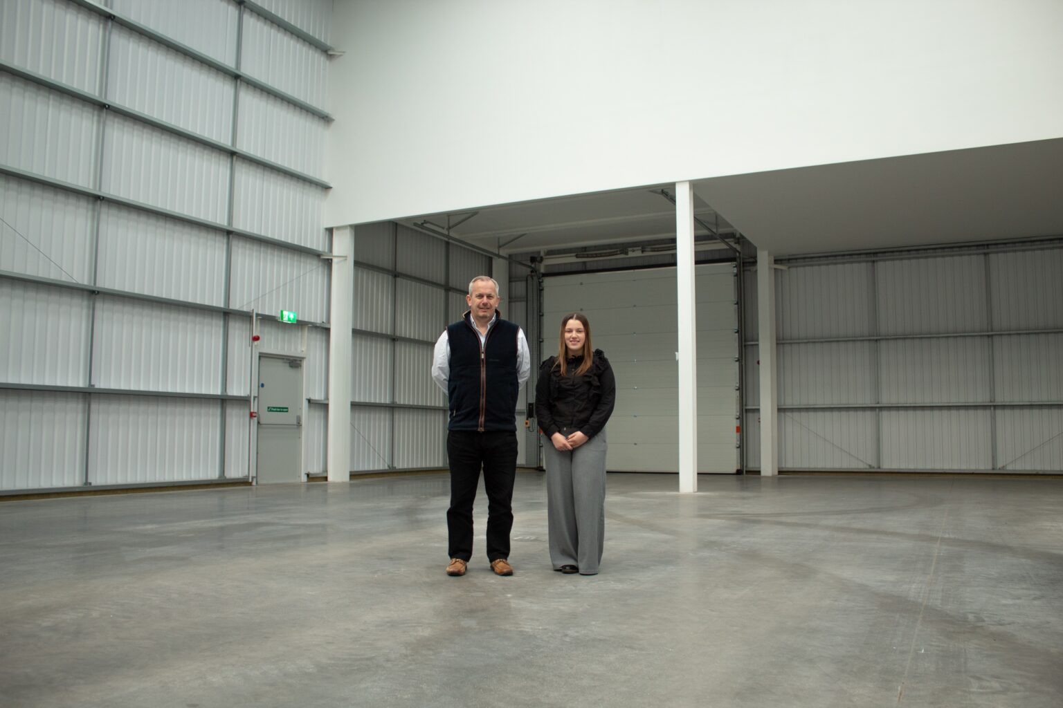 Director of KWB Industrial, Kenny Allan and KWB Industrial apprentice, Ellie Cole inside Prime Park industrial units in Birmingham